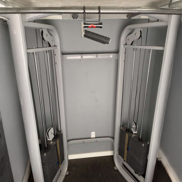 The EZ SQUAT Dumbbell Gym Equipment for Legs Squat Handles sits ready in the gym, ideal for enhancing your leg workouts—perfect for pairing with squats or after a high-energy fitness class.