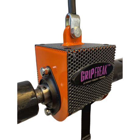 Close-up of the GRIP FREAK Fat Grip Wrist Roller Forearm Workout Tool - Plate Holder, showcasing its sturdy metal mesh surface and bold orange side panel for powerful forearm exercises.