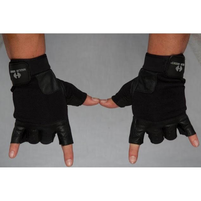 Two hands sporting HAULIN HOOKS GLOVES 'Mens', featuring sleek black design and reinforced finger and palm padding, form a rock-and-roll sign against a gray backdrop.