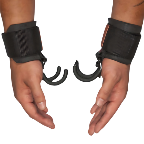 Two hands in black wrist restraints with curved hooks attached—ideal for HAULIN HOOKS 'Hanging Onlys' Weight Lifting Hooks, perfect as USA Made hanging therapy or weight lifting grips.