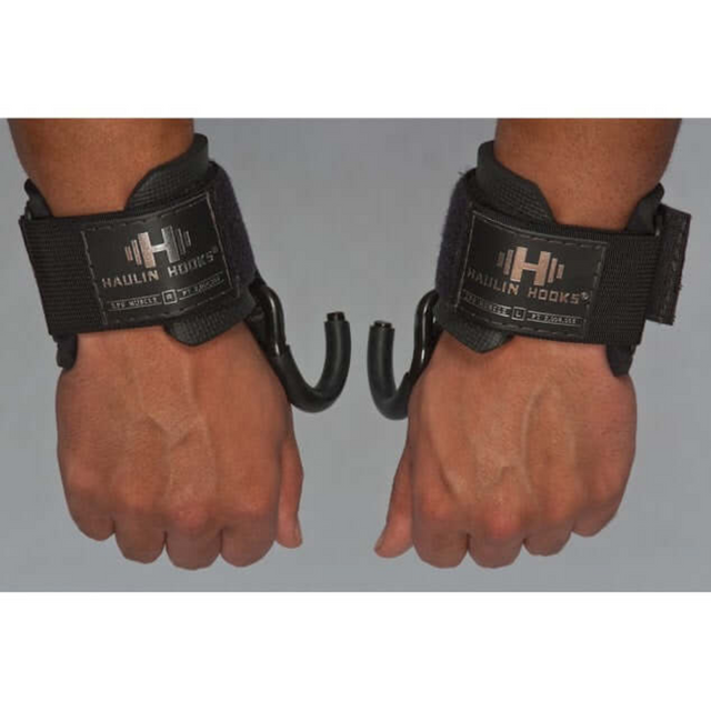 Two hands sporting HAULIN HOOKS 'PROFESSIONAL' in black, featuring neoprene wrist protection, ready for deadlifts.