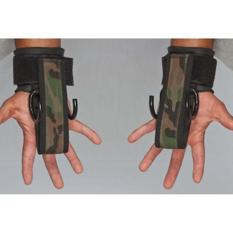 Wearing HAULIN HOOKS 'PROFESSIONAL' camo-patterned lifting straps with metal hooks and neoprene wrist protection against a gray backdrop, hands are prepared for intense deadlifts.