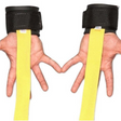 Hands in black wrist supports form a heart shape, with yellow HAULIN HOOKS 'STRAP 650' gym straps made in the USA extending downward.