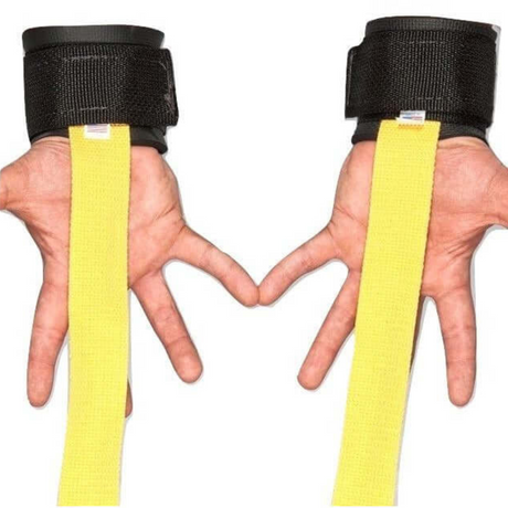 Hands in black wrist supports form a heart shape, with yellow HAULIN HOOKS 'STRAP 650' gym straps made in the USA extending downward.