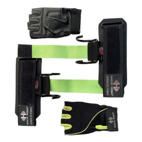 HAULIN HOOKS 'WOMENS' black and green lifting straps and gloves with velcro closures are displayed on a white background, ideal for women who prioritize their fitness.