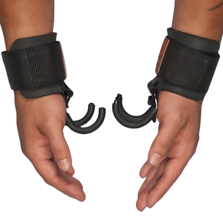 Two hands wearing HAULIN HOOKS ONLYS black wrist cuffs with open, broken plastic handcuffs attached, providing wrist protection and support.