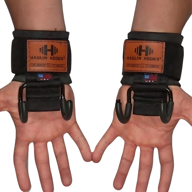 Two hands wearing HAULIN HOOKS ONLYS black wrist straps with metal lifting hooks, palms up, designed for superior muscle isolation and enhanced wrist protection.
