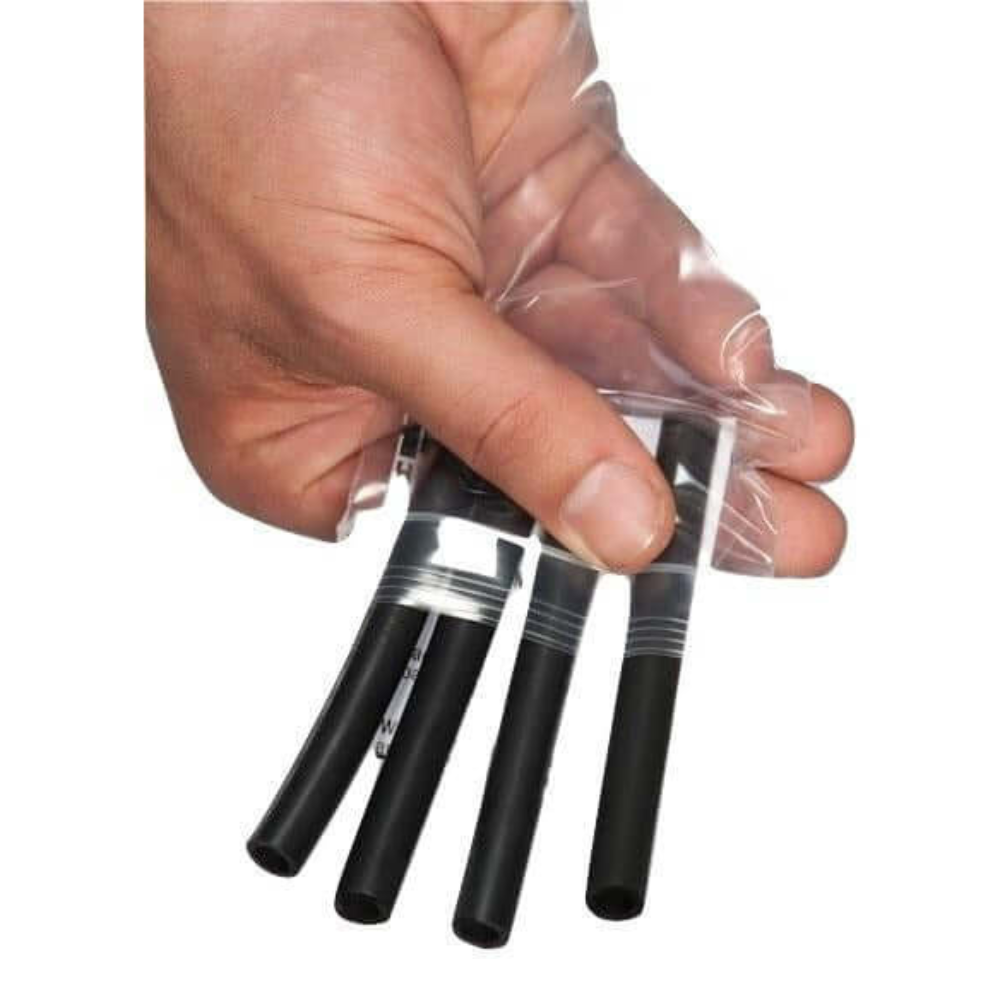 A hand holds a transparent bag with four black flexible tubes, resembling the sleek design of HAULIN HOOKS ‘WOMENS’ fitness lifting straps.
