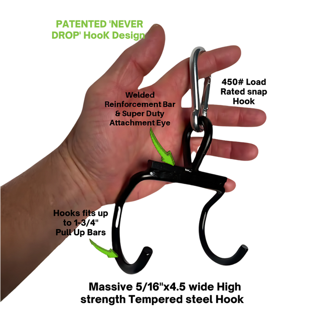 A hand holds the HOG LEGS 'Back Pac' LEGIT Cable Machine Attachments Set—a black metal hook with a carabiner, featuring labeled design elements—shown on a black background.