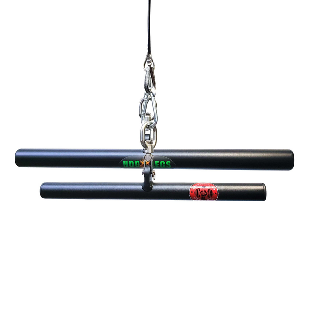 Two black nunchakus connected by a chain showcase green and red logos on each handle, echoing the vibrant patterns seen on the HOG LEGS 'Ham Hock' FAT Cable Curl Bar Extreme!.