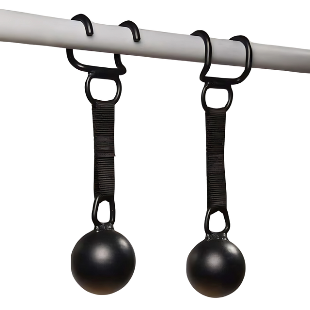 Two HOG LEGS 'Raging Boar' Pull-Up Grips, black balls with straps, hang from hooks on a horizontal bar—ideal for building grip strength and working back muscles.