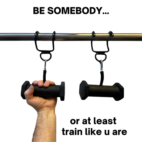 A hand grips a PULL FORCE GEN2 Handle for Pull up Bar, attached to a metal bar with hooks and carabiners, enhancing muscle stimulation.