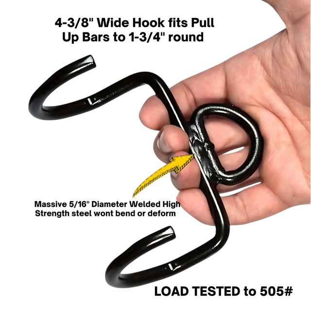 A hand holds a PULL FORCE 'MAINBEAM' Modular Cable Attachment in black metal, featuring two hooks and a yellow rope.
