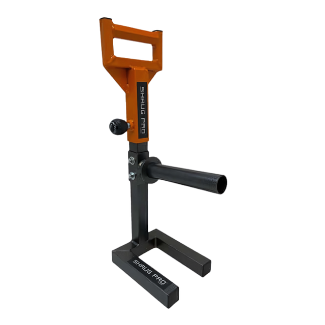 The SHRUG PRO Freestanding Hex Bars Trap Bar Barbell Shrug Alternative - Without Rollers is black and orange gym equipment with adjustable handles and a weight holder, inspired by the classic hex bar trap design.