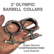 A hand holds two STEEL 2" Olympic Barbell Collars featuring shiny, solid steel construction and compression ring lock downs.