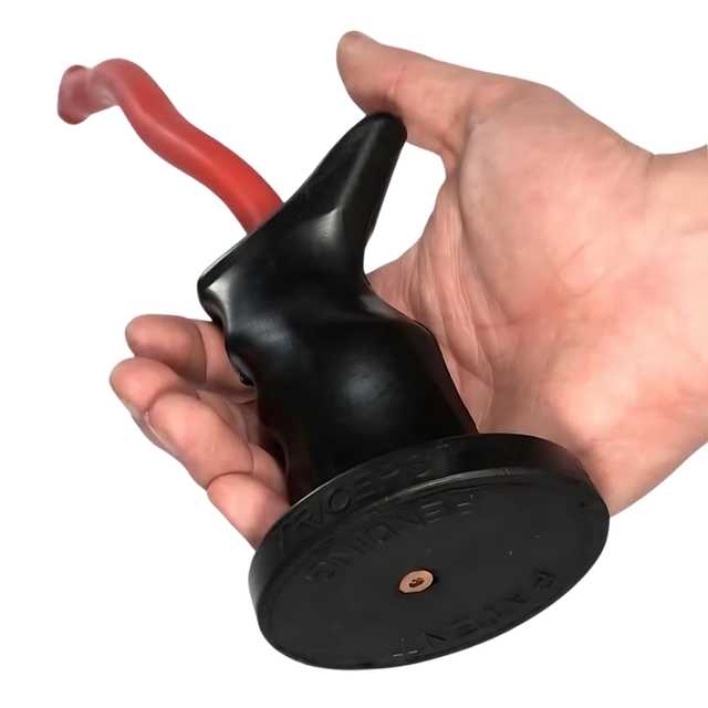 A hand holding the TACTI - TRICEPS 'Single' Tricep Attachment for Cable Machine, shown in black with a red handle and a tactical grip for enhanced control.