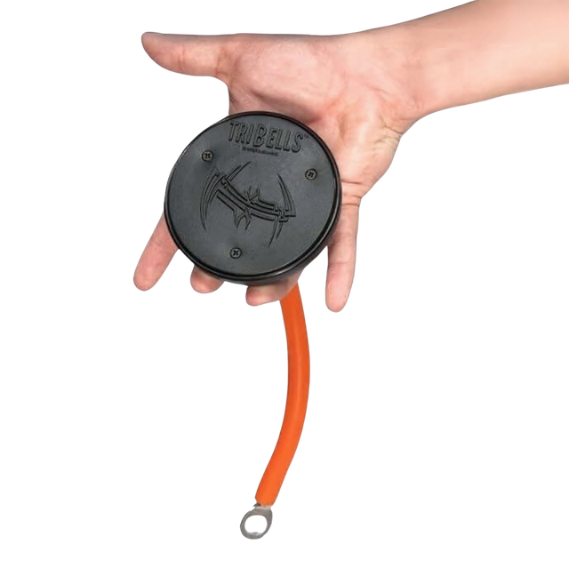 A hand holds the TRIBELLS 4" 'Hi-Tech' Cable Tricep Attachment, a black and orange tool with a looped end and logo, ideal as a tricep rope replacement for cable machines to enhance triceps workouts.