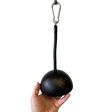 A hand holds the TRIBELLS 6" Palms Grip Tricep attachment, a black domed tool with an orange-speckled pattern, hanging from a carabiner—hygienic and perfect for tricep extension cable workouts that outclass dumbbells.