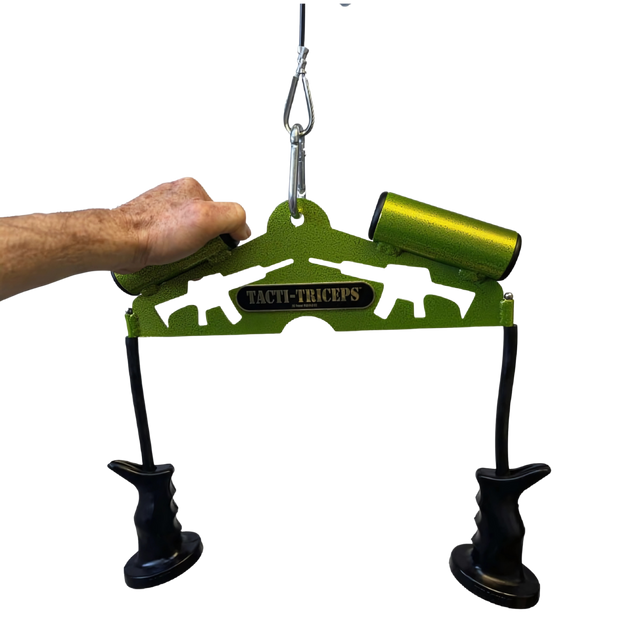 A hand grips the green TRICEPS TRIBULATION Cable Machine Attachment Set with black handles and a carabiner, perfect for triceps workouts or any cable gym machine.