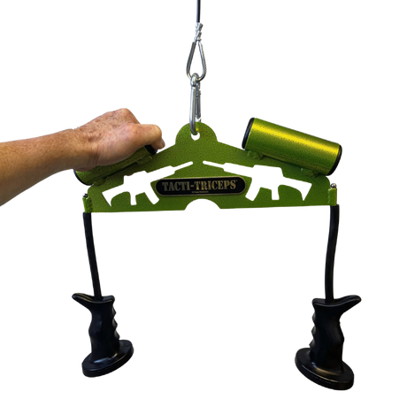 A hand holds the TRICEPS TRIBULATION Cable Machine Attachment Set, featuring green grips, black ergonomic handles, and a metal hook—ideal for cable gym workouts.