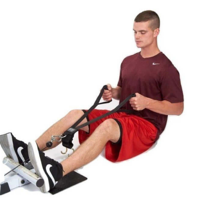 A man in red attire exercises on a white background using DELT-BELT Handle Straps for Cable Machine Upright Rows as a dumbbell alternative for targeted muscle training.
