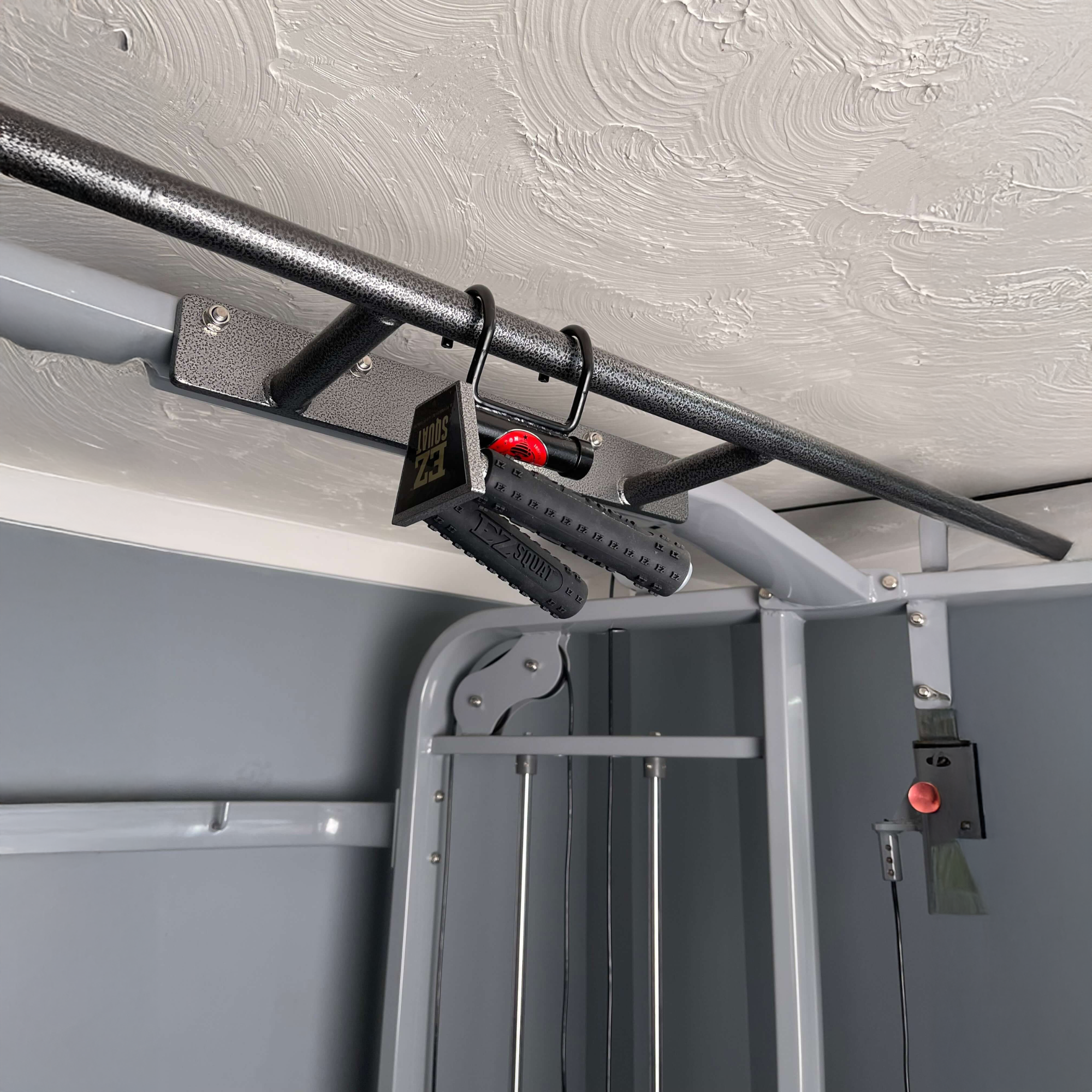 Close-up of an EZ SQUAT Dumbbell Gym Equipment for Legs Squat Handles attached to a pull-up bar—ideal accessory for improving grip during squat routines or fitness classes.