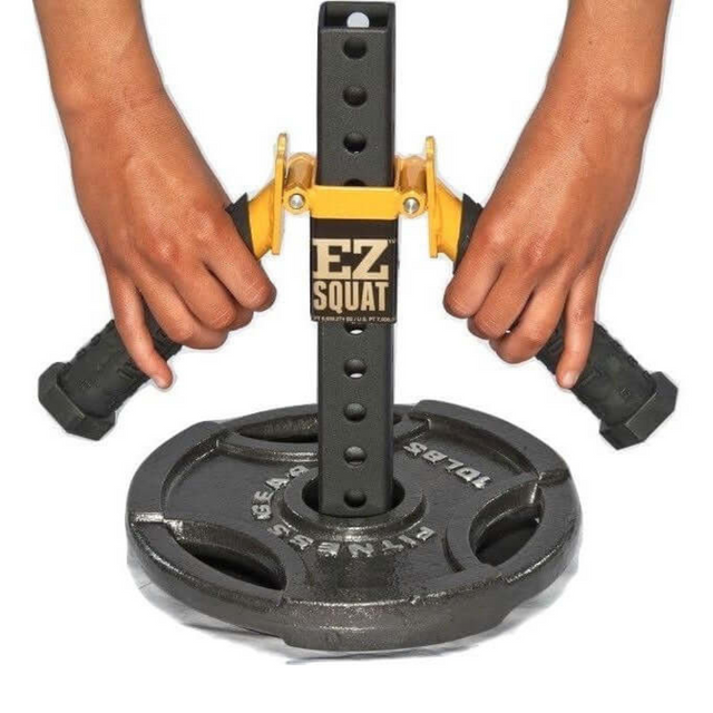 Hands gently adjusting the EZ SQUAT Handles System Squat Machine Attachment connected to an Olympic Weight Plate, all set against a pristine white background—perfect for any home gym.