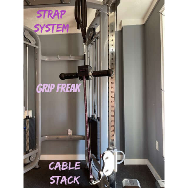 The GRIP FREAK Fat Grip WRIST ROLLER Forearm Workout Tool features a strap system, GRIP FREAK handle, and cable stack in a gym setting, ideal for enhancing Crushing Grip Torque.