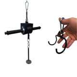 A hand grips the GRIP FREAK 'Slip Grip' Brutal Hand Grip Strengthener, a black tool with handles and metal attachments—perfect for grip targeting or an intense forearm workout.