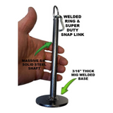 A hand grips a GRIP FREAK 'Slip Grip' Brutal Hand Grip Strengthener, featuring a metal tool with a sturdy base, shaft, ring, and snap link that enhances forearm workout grip strength.