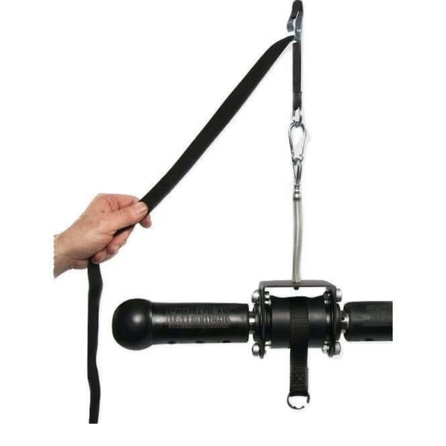 A hand firmly grips a black strap from the GRIP FREAK Universal Suspension Strap System, showcasing its exceptional design.
