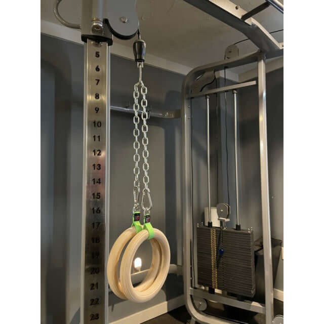 Gymnastic Rings Cable Machine Handles elevate your home gym machine by elegantly hanging wood rings from a metal chain, transforming it into a versatile workout station.