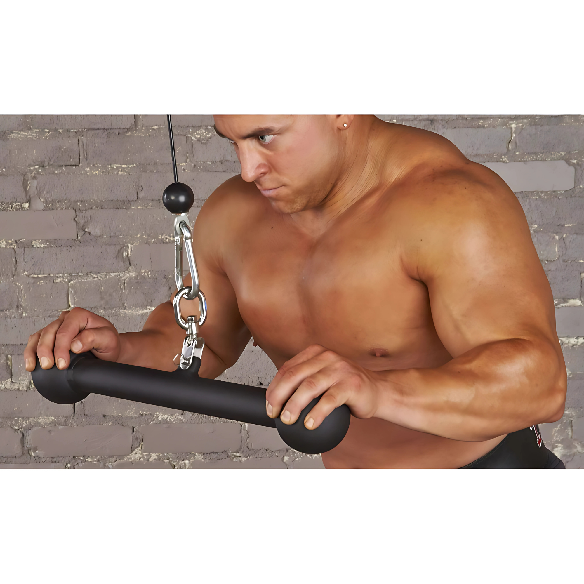 A shirtless man uses the HOG LEGS 'Arm Yourself' Cable Machine Attachments Set with a black bar, targeting biceps and forearm grip for optimal muscle development against a brick wall background.