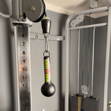 Close-up of the HOG LEGS 'Fist Full' Pullup Handles & Tricep Attachment, showcasing ball grips on the weighted cable attachment with a numbered resistance column to boost grip strength.