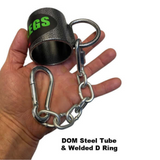 A hand holds a steel tube with a D-ring, chain, and carabiner. Text reads "HOG LEGS 'Jawbone' FAT Back Cable Workout Handles," featuring FAT Grip Handle for enhanced strength.