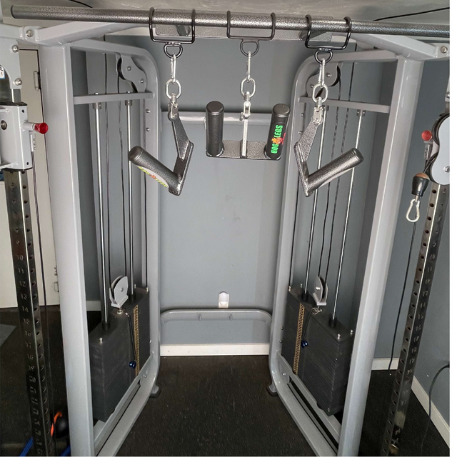 The HOG LEGS 'Multi-Row' Low Pulley Cable Row Handles Plus is a versatile cable crossover machine with pulleys, weights, and various handles, ideal for pull-ups and seated rows in your gym routine.