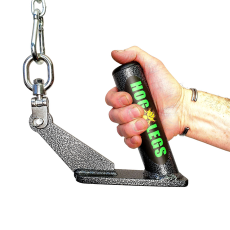 A hand holds a "HOG LEGS 'Jawbone' FAT Back Cable Workout Handle" with a stainless steel attachment ring and metal chain, set against a plain white background.