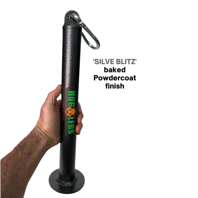 A hand holds a HOG LEGS Weight Load Pin / Weight Plate Holder, made of black metal with "HOG LEGS" text and a carabiner on top, ideal for strength training, set against a black background.