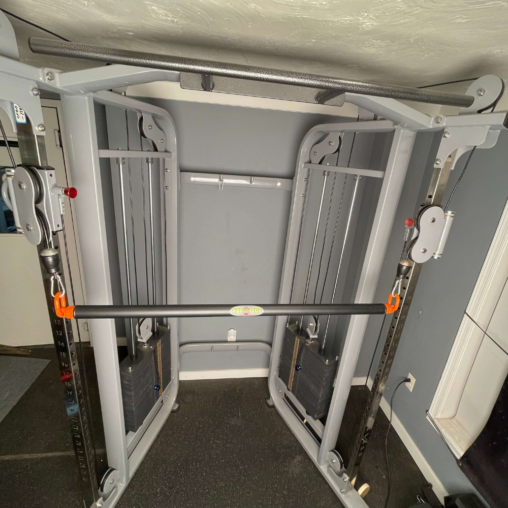 Enhance your home gym with the HOG LEGS 'PRO' Dual Cable Bar attachments. Adjustable pulleys and weight stacks provide a commercial-grade workout, all backed by a lifetime warranty for peace of mind.