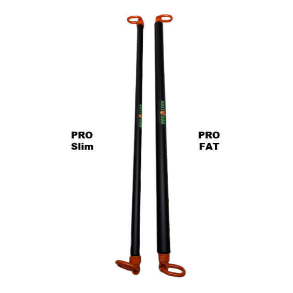 Two long black and orange pole tools labeled "PRO Slim" and "PRO Fat," part of the HOG LEGS 'PRO' Dual Cable Bar Gym Attachments, stand upright side by side, built to commercial-grade durability standards.