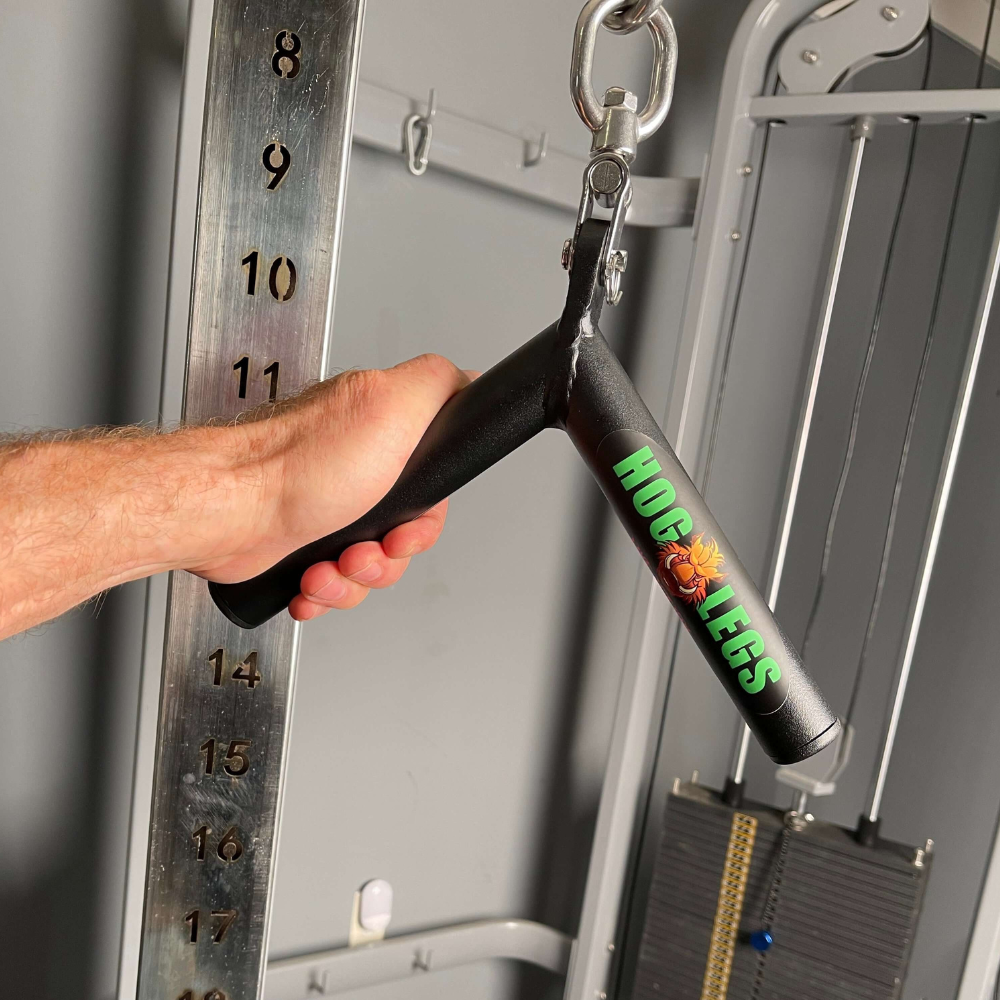 A person expertly grips a black HOG LEGS 'Pork Chop' Killer Triceps Workout Cable Bar, attached to a gym cable machine, setting up for triceps extensions to perfect those Cable Press Downs.