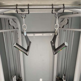 Two black HOG LEGS Pull Up Hooks for Exercise Cable Attachments are incorporated into a sturdy exercise setup, supported by metal structures in the background.
