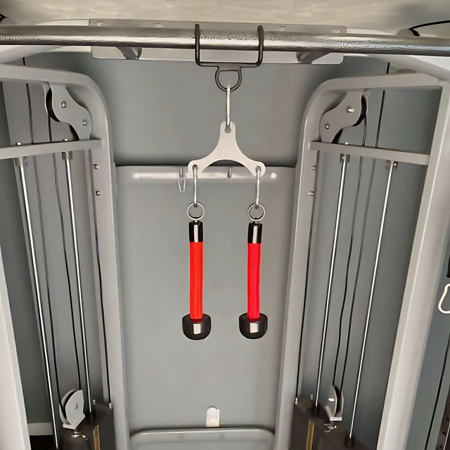 Two HOG LEGS Pull Up Hooks for Exercise Cable Attachments in red and black with a sleek powder coat finish hang securely from a patented hook in a gym setting.