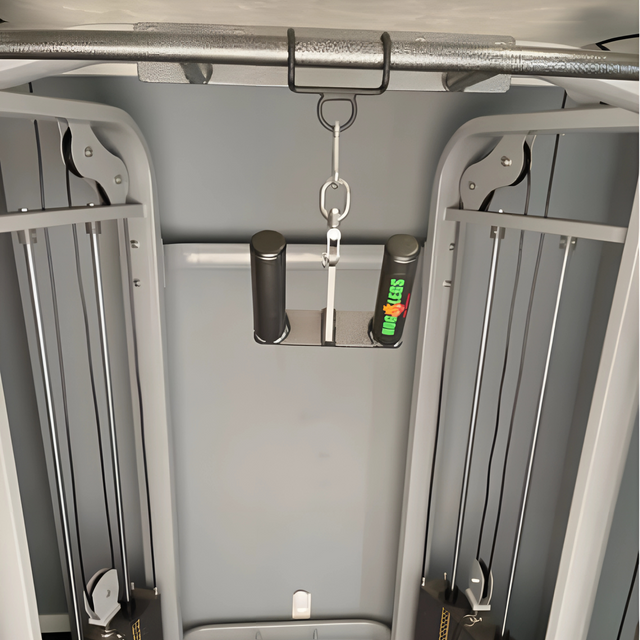 Gray cable machine featuring HOG LEGS Pull Up Hooks for exercise cable attachments, patented handles, metal hook attachments, and a green water bottle on the tray.