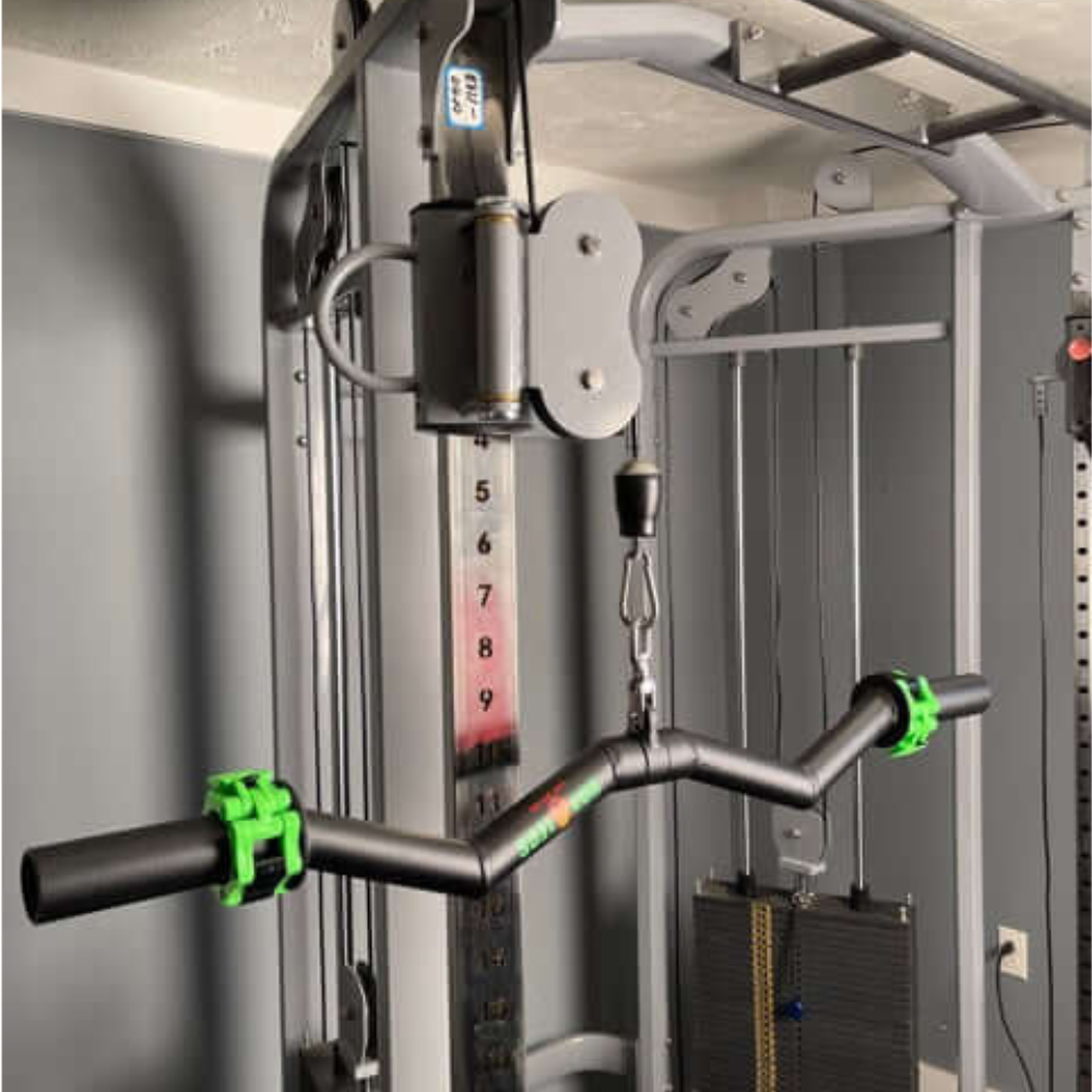 Explore home gym equipment with the HOG LEGS Super Subprimal Cable & Olympic Easy Curl Bar, featuring striking green grips.