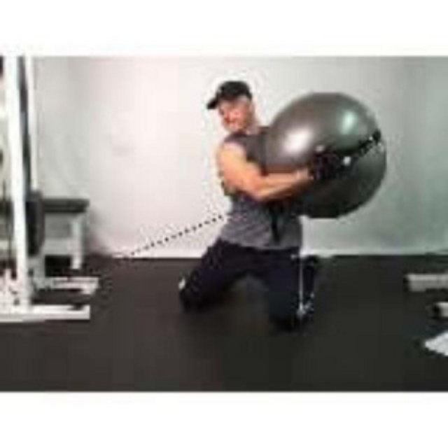 A man kneels, performing a Physio Twist using PHYSIO TWIST Swiss Ball Handle Straps for a cable machine to build explosive core power in the gym.
