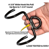 A hand holds a PULL FORCE 'MAINBEAM' Modular Cable Attachment, a wide metal hook for pull-up bars, load tested to 505 pounds—ideal for cable machine exercises and triceps workouts.