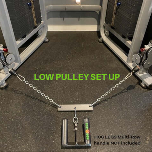 Gym cable machine weight stacks with metal handle and chain on the floor, featuring the "PULL FORCE MULTIPLIER," for enhanced low pulley setup.