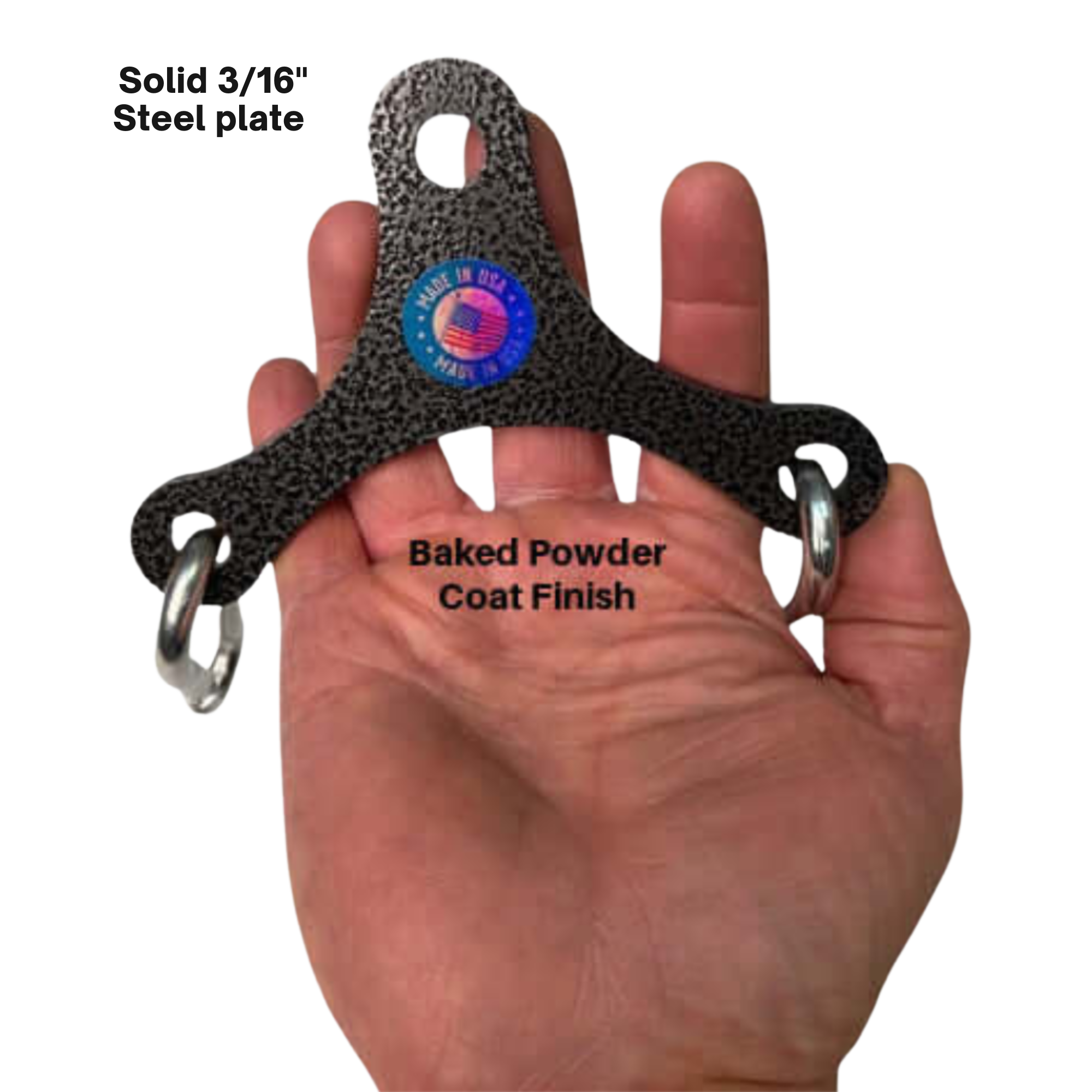 A hand holds the PULL FORCE Mini Multiplier Home Gym Cable Machine Yoke—a three-pronged black steel plate with rings, ideal for dual cable machines, featuring a "Made in USA" sticker and a lifetime replacement warranty.