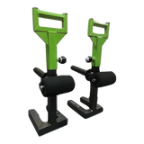 Two green and black SHRUG PRO Freestanding Hex Bars serve as a barbell shrug alternative without rollers, featuring sturdy bases, ideal for use with a trap bar or on a freestanding shrug platform.